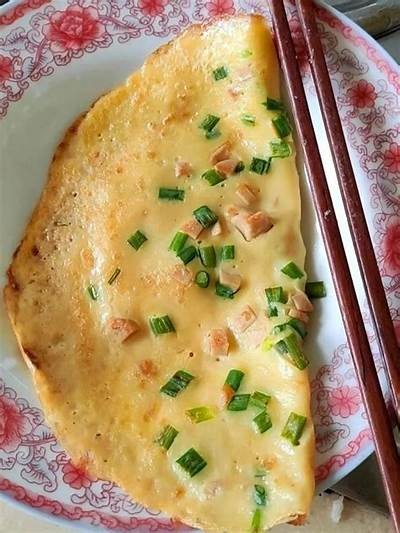 美食主播分享：香滑糖心鸡蛋饼的制作秘诀与美味体验